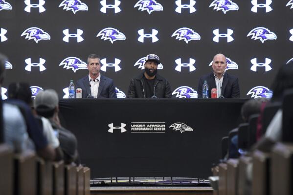 Recently signed Baltimore Ravens wide receiver Odell Beckham Jr., center, sits with head coach John Harbaugh, left, and general manager Eric DeCosta during a news conference at the team's practice facility in Owings Mills, Md., on Thursday, April 13, 2023. (AP Photo/Steve Ruark)