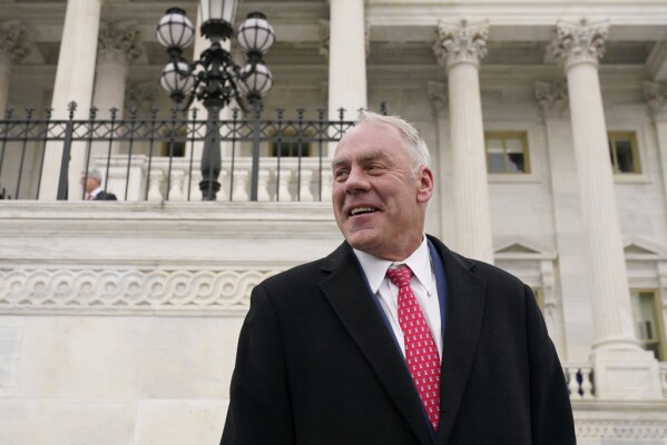 FILE - Then Rep.-elect Ryan Zinke, R-Mont., stands on the East Front of the Capitol after participating in a class photo of newly-elected members of Congress, Nov. 15, 2022, in Washington. (AP Photo/Patrick Semansky, File)