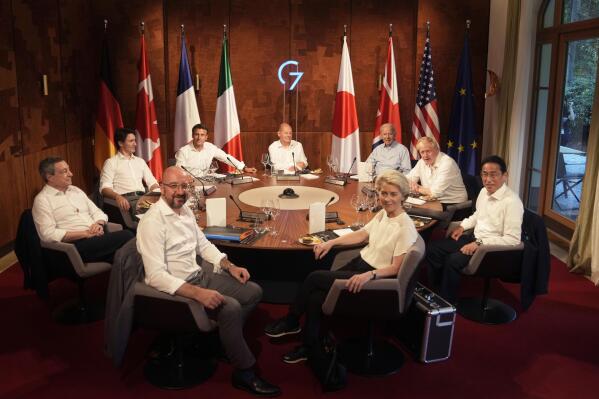 Group of Seven leaders gather for a dinner event at Castle Elmau in Kruen, near Garmisch-Partenkirchen, Germany, on Sunday, June 26, 2022. The Group of Seven leading economic powers are meeting in Germany for their annual gathering Sunday through Tuesday. Leaders clockwise from front left, European Council President Charles Michel, Italy's Prime Minister Mario Draghi, Canada's Prime Minister Justin Trudeau, French President Emmanuel Macron, German Chancellor Olaf Scholz, U.S. President Joe Biden, British Prime Minister Boris Johnson, Japan's Prime Minister Fumio Kishida and European Commission President Ursula von der Leyen. (AP Photo/Markus Schreiber, Pool)