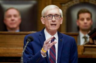 FILE - Wisconsin Gov. Tony Evers addresses a joint session of the Legislature in the Assembly chambers during the governor's State of the State speech at the state Capitol on Feb. 15, 2022, in Madison, Wis. Evers proposed a $600 million annual tax cut on Tuesday, Aug. 23, 2022, an election year proposal that's all-but certain to be summarily rejected by the Republican-controlled Legislature. (AP Photo/Andy Manis, File)