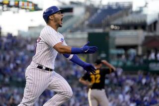 Chicago Cubs' Willson Contreras celebrates his grand slam off Pittsburgh Pirates relief pitcher Bryse Wilson, background, during the first inning of a baseball game Monday, May 16, 2022, in Chicago. (AP Photo/Charles Rex Arbogast)
