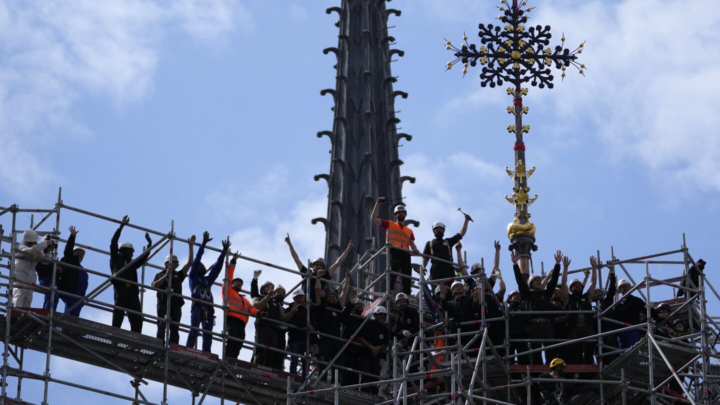 Notre-Dame's Intact Cross: A Symbol of Resilience, Reinstalled atop Parisian Landmark after Five-Year Restoration