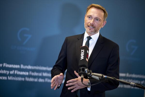 Christian Lindner , Federal Minister of Finance, gives a statement on the excess profits tax at the Ministry of Finance. (Fabian Sommer/dpa via AP)