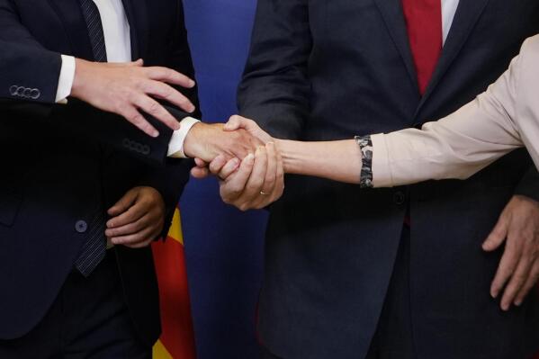 From right, European Commission President Ursula von der Leyen, Albanian Prime Minister Edi Rama, North Macedonia's Prime Minister Dimitar Kovacevski and Czech Republic's Prime Minister Petr Fiala shake hands prior to a meeting at EU headquarters in Brussels, Tuesday, July 19, 2022. The European Union on Tuesday is starting the long enlargement process that aims to lead to the membership of Albania and North Macedonia in the bloc. (AP Photo/Virginia Mayo)