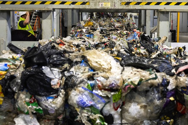 FILE - Plastic waste runs on conveyor belts at a new plastic waste sorting facility in Motala, central Sweden, Thursday, Nov. 9, 2023. European Union countries and lawmakers sealed a deal Friday, Nov. 17, 2023 to stop sending their plastic rubbish to poor countries. Under the agreement, the 27 EU countries will no longer be able to export their plastic waste to non-OECD countries within two and a half years after the regulation becomes a law. (AP Photo/David Keyton, File)