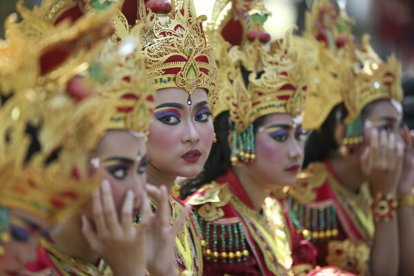 Dancers wait to perform during the opening of Bali Arts Festival in Bali, Indonesia, Sunday, June 18, 2023. (AP Photo/Firdia Lisnawati)