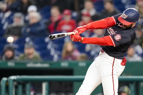 Washington Nationals' Joey Gallo hits a double during the third inning of a baseball game against the Pittsburgh Pirates at Nationals Park, Wednesday, April 3, 2024, in Washington. (AP Photo/Alex Brandon)