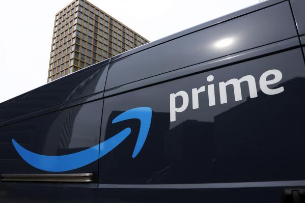 FILE - An Amazon Prime delivery vehicle is seen in downtown Pittsburgh on March 18, 2020. Amazon said Thursday, Oct. 13, 2022, that its Prime members ordered more than 100 million items during a sales event this week that analysts are expecting to be a bellwether for the holiday shopping season. (AP Photo/Gene J. Puskar, File)