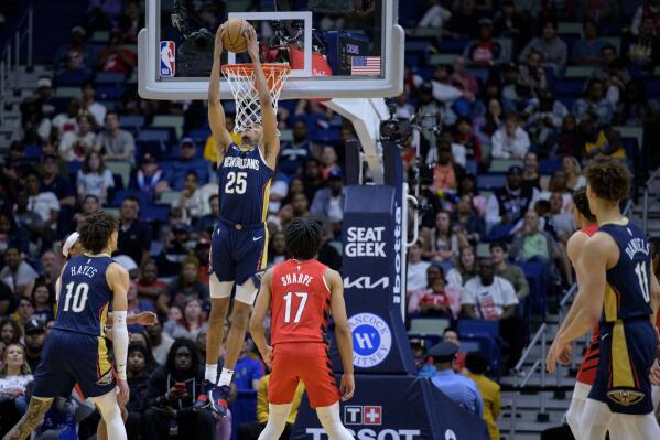 New Orleans Pelicans guard Trey Murphy III (25) dunks in the second half for to bring his total to 41 points in an NBA basketball game against the Portland Trail Blazers in New Orleans, Sunday, March 12, 2023. (AP Photo/Matthew Hinton)