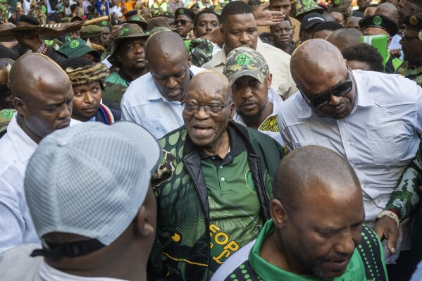 Former South African President Jacob Zuma arrives at Orlando stadium in the township of Soweto, Johannesburg, South Africa, for the launch of his newly formed uMkhonto weSizwe (MK) party's manifesto Saturday, May 18, 2024. Zuma, who has turned his back on the African National Congress (ANC) he once led, will face South African President Cyril Ramaphosa, who replaced him as leader of the ANC in a bitter battle in the general elections later in May. (AP Photo/Jerome Delay)