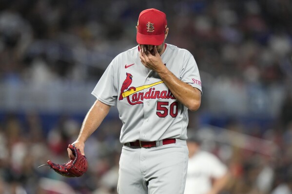St. Louis Cardinals starting pitcher Adam Wainwright (50) walks from the mound after bring relieved during the fourth inning of a baseball game against the Miami Marlins, Tuesday, July 4, 2023, in Miami. (AP Photo/Lynne Sladky)