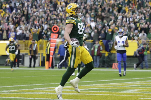 Green Bay Packers tight end Luke Musgrave (88) celebrates after scoring a 20-yard touchdown during the second half of an NFL football game against the Los Angeles Rams, Sunday, Nov. 5, 2023, in Green Bay, Wis. (AP Photo/Matt Ludtke)