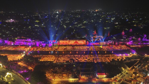 Lamps light up the banks of the river Saryu on the eve of the Hindu festival of Diwali, in Ayodhya, India, Saturday, Nov. 11, 2023. Ayodhya city in the northern Indian state of Uttar Pradesh Saturday set a record by lighting over 2.2 million earthen oil lamps during Deepotsav celebrations on the eve of Diwali, creating a new Guinness World Record for lighting lamps in such a large number, according to state tourism department. (AP Photo/Rajesh Kumar Singh)