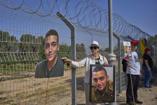Varda Ben Baruch, holds a picture of her grandson Edan Alexander who is held hostage in Gaza, near the Gaza border in Kibbutz Nir Oz, southern Israel, on April 20, 2025. (AP Photo/Ohad Zwigenberg, File)