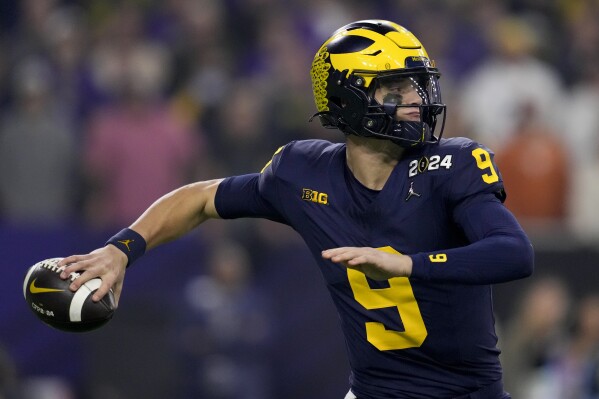 Michigan quarterback J.J. McCarthy passes against Washington during the first half of the national championship NCAA College Football Playoff game Monday, Jan. 8, 2024, in Houston. (AP Photo/Godofredo A. Vasquez)