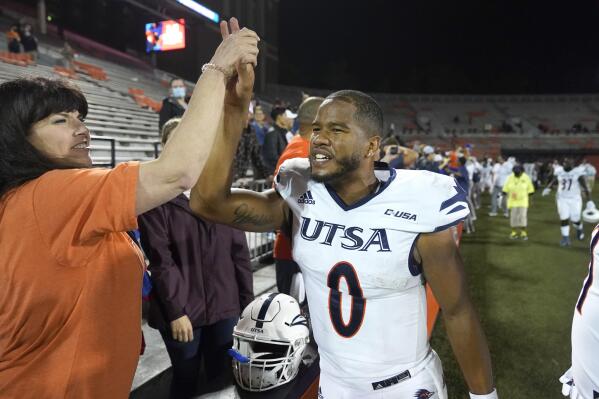 FILE - UTSA quarterback Frank Harris celebrates his team's win over Illinois in an NCAA college football game  in Champaign, Ill., in this Saturday, Sept. 4, 2021, file photo. No. 24 UTSA is nationally ranked for the first time as well as 7-0 for the first time and on its first winning streak as long as seven games as the Roadrunners visit Louisiana Tech. (AP Photo/Charles Rex Arbogast, File)
