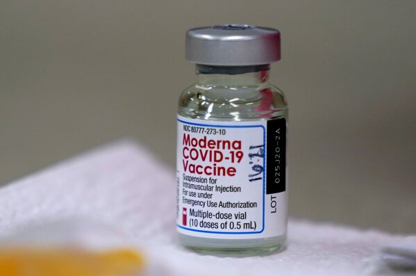 FILE - In this file photo dated Wednesday, Dec. 30, 2020, a bottle of Moderna COVID-19 vaccine on a table before being utilised in Topeka, USA.  The European Union’s medicines agency on Wednesday Jan. 6, 2021, gave the green light to Moderna Inc.’s COVID-19 vaccine, a decision that gives the 27-nation bloc a second vaccine to use to fight the virus rampaging across the continent.(AP Photo/Charlie Riedel, FILE)