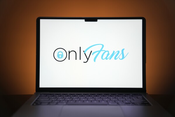 The OnlyFans logo is seen on a computer monitor in this posed photo, Thursday, Dec. 7, 2023, in St. Louis. The site and others like it provide an opportunity for those willing to dabble in pornography to earn extra money, including two teachers at the same Missouri high school. (AP Photo/Jeff Roberson)