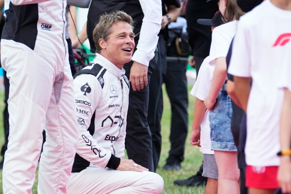 Actor Brad Pitt appears on the grid before the British Formula One Grand Prix race at the Silverstone racetrack, Silverstone, England on July 9, 2023. (AP Photo/Luca Bruno, File)
