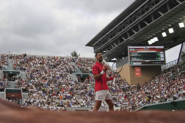 Serbia's Novak Djokovic reacts as he plays France's Corentin Moutet during their second round match of the French Tennis Open, at the Roland-Garros stadium, in Paris, Thursday, May 29, 2025. (AP Photo/Christophe Ena)