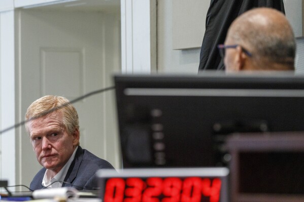 FILE - Judge Clifton Newman, right, addresses Alex Murdaugh, left, who testifies on the stand as the court takes a recess at the Colleton County Courthouse, Feb. 23, 2023, in Walterboro, S.C. On Wednesday, Nov. 1, Murdaugh's lawyers asked the South Carolina Supreme Court to prevent Newman from deciding whether Murdaugh gets a new trial because they accuse a clerk of tampering with the jury and said Newman may be called to testify. (Grace Beahm Alford/The Post And Courier via AP, Pool, File)