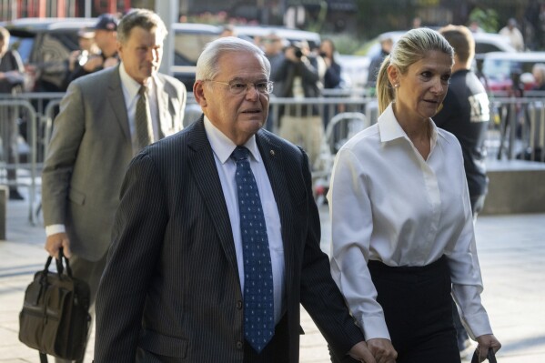 FILE - Democratic U.S. Sen. Bob Menendez of New Jersey, left, and his wife, Nadine Menendez, arrive at the federal courthouse in New York, Sept. 27, 2023. Menendez may seek exoneration at his May 2024 bribery trial by blaming his wife, saying she kept him in the dark about anything that could be illegal about her dealings with New Jersey businessmen, according to court papers unsealed Tuesday, April 16, 2024. (AP Photo/Jeenah Moon, File)