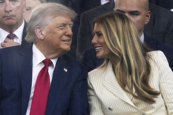 President Donald Trump and first lady Melania Trump attend a military parade commemorating the Army's 250th anniversary, coinciding with his 79th birthday, Saturday, June 14, 2025, in Washington. (AP Photo/Julia Demaree Nikhinson)