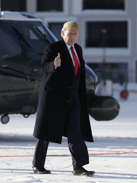 US President Donald Trump gestures as he arrives in Davos, Switzerland on Marine One, Tuesday, Jan. 21, 2020. President Trump arrived in Switzerland on Tuesday to start a two-day visit to the World Economic Forum. (AP Photo/Evan Vucci)