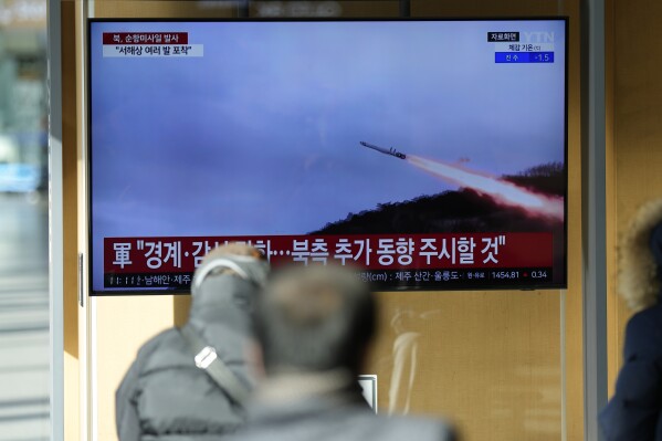 A TV screen shows a report of North Korea's cruise missiles with file footage during a news program at the Seoul Railway Station in Seoul, South Korea, Wednesday, Jan. 24, 2024. South Korea's military says North Korea fired several cruise missiles into waters off its western coast, adding to a provocative run of weapons demonstrations in the face of deepening nuclear tensions with the United States, South Korea and Japan. (AP Photo/Lee Jin-man)