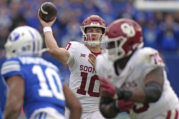 FILE - Oklahoma quarterback Jackson Arnold (10) throws against BYU during the second half of an NCAA college football game Saturday, Nov. 18, 2023, in Provo, Utah. After all the hype, the Jackson Arnold era is set to begin at Oklahoma as the new starter heading into their Alamo Bowl matchup with No. 14 Arizona on Thursday, Dec. 28. (AP Photo/Rick Bowmer, File)
