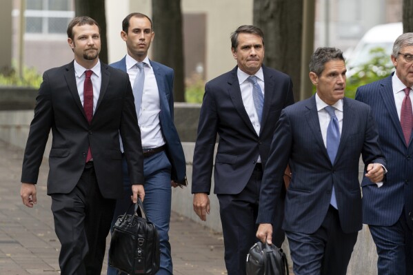 Former President Donald Trump attorneys from left, Gregory Singer, Stephen Weiss, Todd Blanche and John Lauro arrive at the E. Barrett Prettyman U.S. Federal Courthouse, Monday, Aug. 28, 2023, in Washington. (AP Photo/Jose Luis Magana)