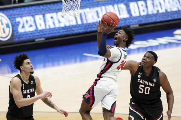 FILE - Mississippi's Jarkel Joiner (24) shoots over South Carolina's Trey Anderson, left, and Tre-Vaughn Minott (50) in the first half of an NCAA college basketball game in the Southeastern Conference Tournament in Nashville, Tenn., in this Thursday, March 11, 2021, file photo. Ole Miss is now led by No. 2 scorer Jarkel Joiner and seven newcomers. (AP Photo/Mark Humphrey, File)