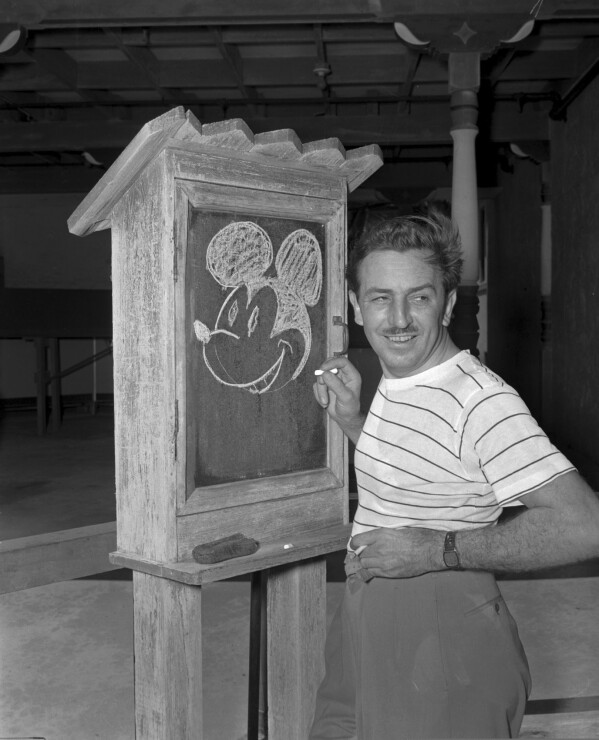 FILE - Walt Disney, creator of Mickey Mouse, poses for a photo at the Pancoast Hotel, Aug. 13, 1941, in Miami, Fla. The earliest version of Disney's most famous character, Mickey Mouse, and arguably the most iconic character in American pop culture, will become public domain on Jan. 1, 2024. (AP Photo, File)