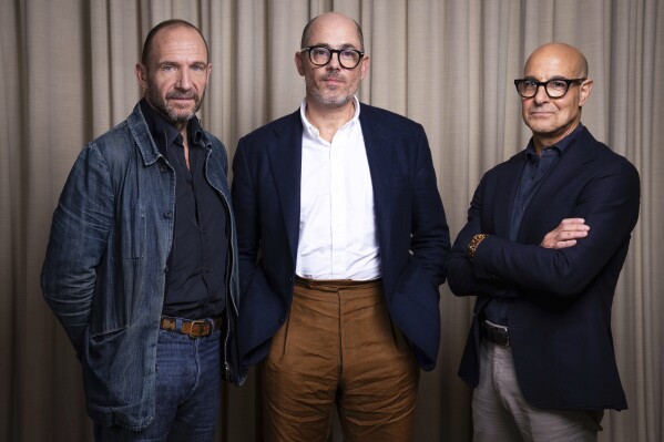 Ralph Fiennes, from left, director Edward Berger and Stanley Tucci pose for portrait photographs for the film "Conclave'"on Thursday, Oct. 10, 2024, in London. (Photo by Scott A Garfitt/Invision/AP)