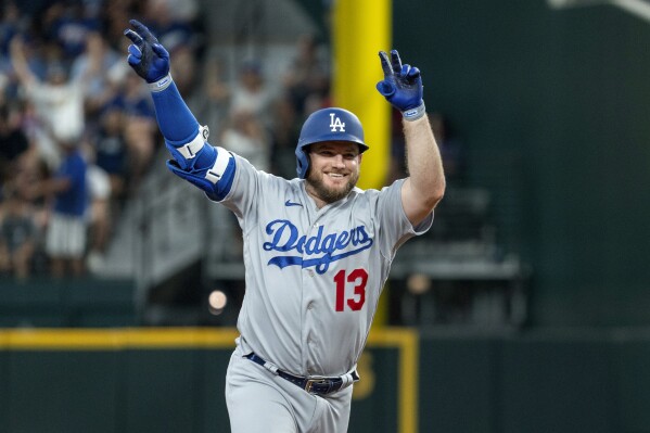 Los Angeles Dodgers' infielder Max Muncy celebrates with teammate