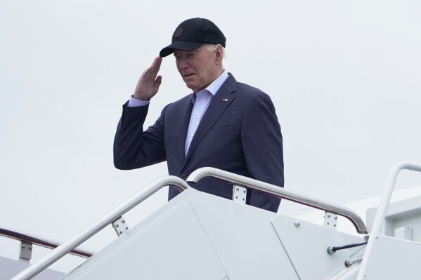 President Joe Biden salutes as he boards Air Force One as he leaves Andrews Air Force Base, Md., on his way to his Delaware home, Friday, April 19, 2024. (AP Photo/Manuel Balce Ceneta)