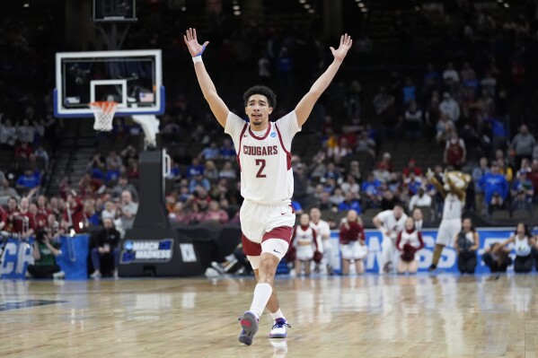 Washington State's Myles Rice (2) celebrates following a first-round college basketball game against Drake in the NCAA Tournament Thursday, March 21, 2024, in Omaha, Neb. Washington State won 66-61. (AP Photo/Charlie Neibergall)