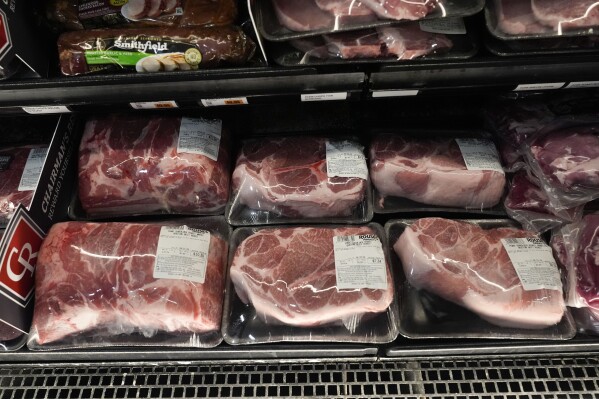Pork products line the cooler at a grocery store in New Orleans, April 17, 2024. (AP Photo/Gerald Herbert, File)