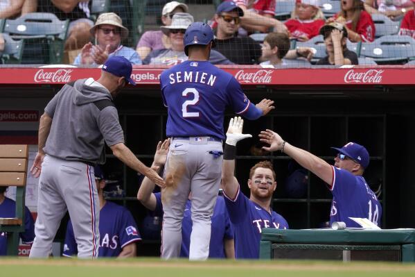 Texas Rangers' Ezequiel Duran, left, is caught stealing second