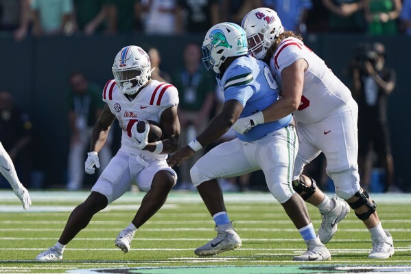 Mississippi running back Quinshon Judkins (4) carries in the second half of an NCAA college football game against Tulane in New Orleans, Saturday, Sept. 9, 2023. Mississippi won 37-20. (AP Photo/Gerald Herbert)