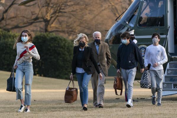 FILE - In this March 24, 2021 photo, President Joe Biden and first lady Jill Biden with their grandchildren Natalie Biden and Hunter Biden, walk on the South Lawn upon arrival at the White House in Washington from a weekend trip to Wilmington, Del. (AP Photo/Manuel Balce Ceneta)