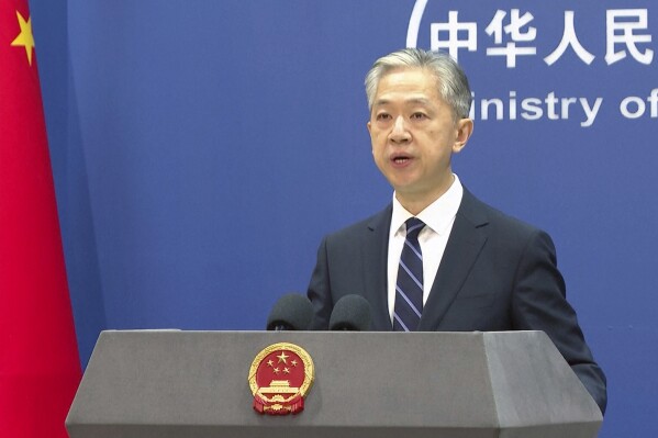 Chinese Foreign Ministry spokesperson Wang Wenbin speaks during a press conference at the Ministry of Foreign Affairs in Beijing, Friday, June 16, 2023. China's government on Friday rejected as "far-fetched and unprofessional" a report by a U.S. security firm that blamed Chinese-linked hackers for attacks on hundreds of public agencies, schools and other targets around the world. (AP Photo/Liu Zheng)