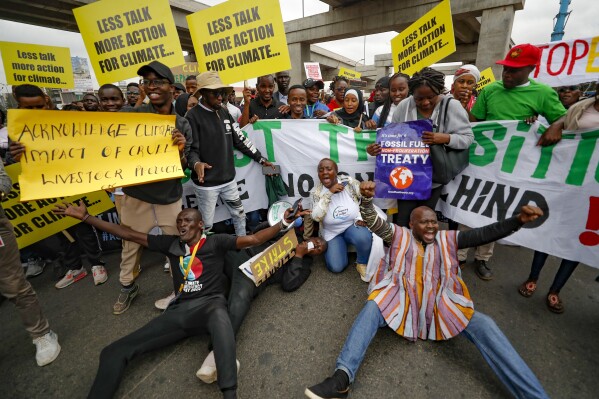 Protesters gather to demand action on climate change, in the streets, in downtown Nairobi, Kenya, Monday, Sept. 4, 2023 as the Africa Climate Summit begins. The first African Climate Summit is opening with heads of state and others asserting a stronger voice on a global issue that affects the continent of 1.3 billion people the most, even though they contribute to it the least. Kenya's government and the African Union are launching the ministerial session while more than a dozen heads of state begin to arrive, determined to wield more global influence and bring in far more financing and support. (AP Photo/Brian Inganga)