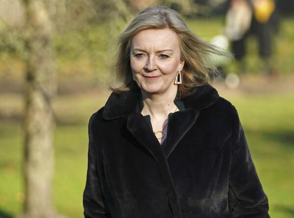 British Foreign Secretary Liz Truss walks through St. James's Park, central London, Friday, Jan. 14, 2022 after her comments that there is a "deal to be done" with the European Union over the Northern Ireland Protocol. U.K. Foreign Secretary Liz Truss called for Britain and the European Union to rebuild their relationship, as she and bloc’s top Brexit official met Thursday for talks on a thorny dispute over Northern Ireland trade. (Aaron Chown/PA via AP)