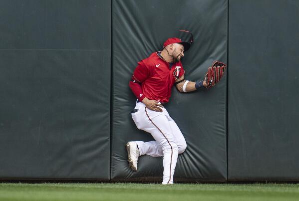 Minnesota Twins centerfielder Royce Lewis snags a fly ball hit by Kansas City Royals' Emmanuel Rivera in the sixth inning of a baseball game in Minneapolis, Sunday, May 29, 2022. Lewis was injured on the play after he collided with the wall. (Jerry Holt/Star Tribune via AP)