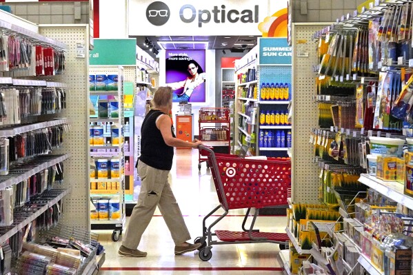 A shopper looks down an aisle in a Target store in Upper Saint Clair, Pa., on Friday, July 7, 2023. On Wednesday, the Labor Department reports on U.S. consumer prices for June.(AP Photo/Gene J. Puskar)