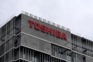 The logo of Toshiba Corp. is seen at the company's building in Kawasaki near Tokyo, on Feb. 19, 2022. Shareholders of embattled Japanese electronics and energy giant Toshiba Corp. voted down a major restructuring plan on Thursday, March 24. (AP Photo/Shuji Kajiyama)
