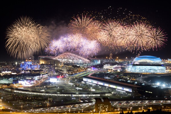 FILE - Fireworks explode over Olympic Park at the closing ceremony of the 2014 Winter Olympics, in Sochi, Russia, Sunday, Feb. 23, 2014. It cost Russia an estimated $55 billion to prepare and host the Olympics in the balmy Black Sea resort, where most facilities, including 11 sports arenas, were built from scratch along with highways, rail lines and other infrastructure. (AP Photo/Pavel Golovkin, File)