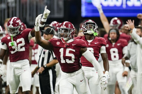 Alabama linebacker Dallas Turner (15) celebrates after taking down Georgia offense during the second half of the Southeastern Conference championship NCAA college football game in Atlanta, Saturday, Dec. 2, 2023. (AP Photo/Mike Stewart)