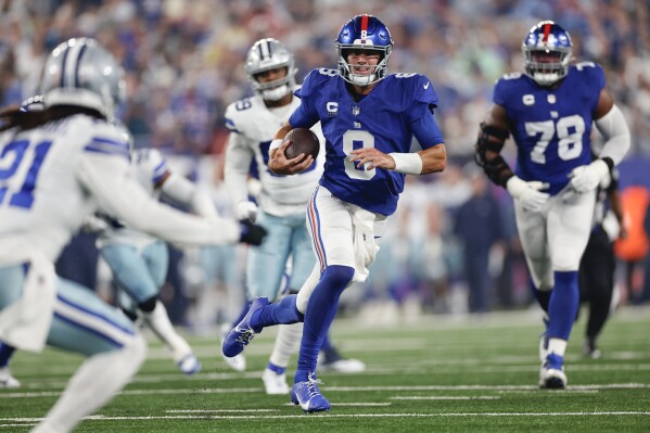 New York Giants' Daniel Jones (8) runs the ball during the first half of an NFL football game against the Dallas Cowboys, Sunday, Sept. 10, 2023, in East Rutherford, N.J. (AP Photo/Adam Hunger)